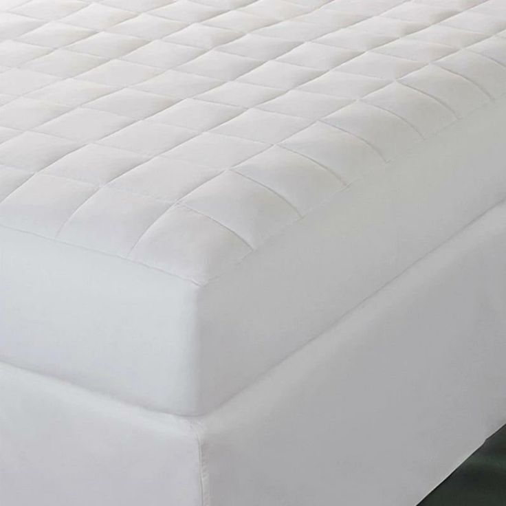 A plush, quilted mattress pad designed for comfort and protection, showcasing one of the best mattress pads for enhancing sleep quality and mattress longevity.