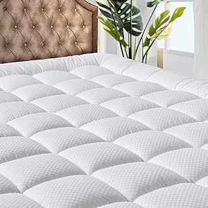 Plush, quilted mattress topper enhancing comfort and support, demonstrating the best thickness for a mattress for restful sleep.