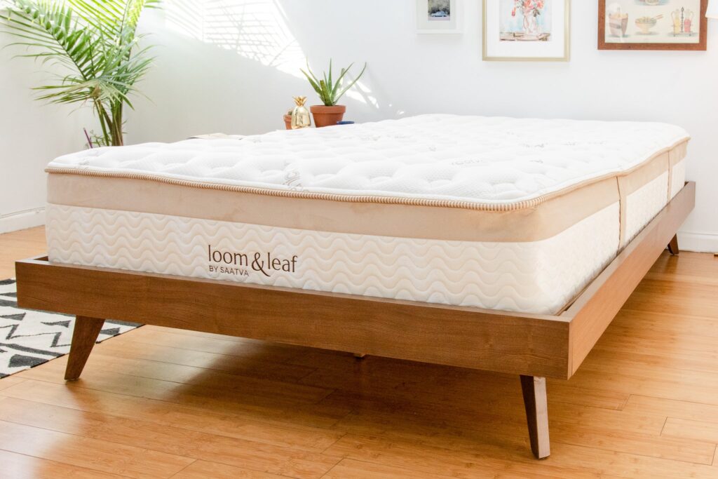  A large, flat pad that supports a person's body while lying down 